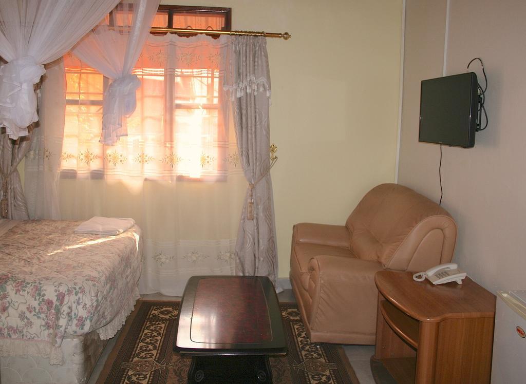 Hotel Acacia Кампала Номер фото